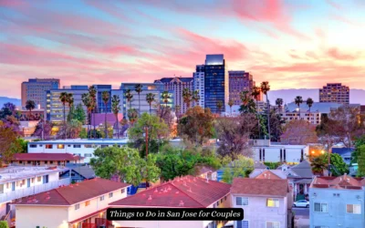 A vibrant sunset over San Jose, California, with palm trees and a mix of residential and modern buildings. A text overlay reads, Things to Do in San Jose for Couples.