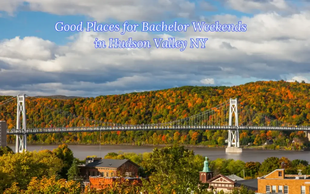 A scenic view of the Hudson Valley in NY featuring a bridge over a river, surrounded by autumn foliage. Text reads, Good Places for Bachelor Weekends in Hudson Valley NY.