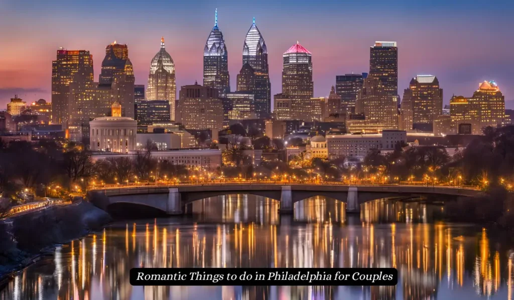 A nighttime view of Philadelphias skyline with brightly lit skyscrapers. The city lights reflect on the river below, and a bridge is visible in the foreground. The sky is a gradient of blue and orange. Text reads, Romantic Things to do in Philadelphia for Couples.